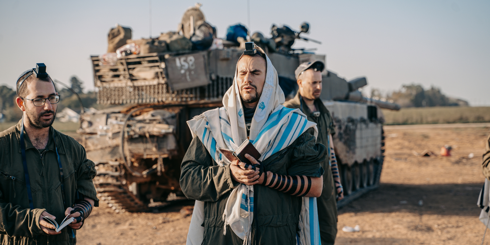 IDF soldiers pray before entering Gaza (Shutterstock.com)