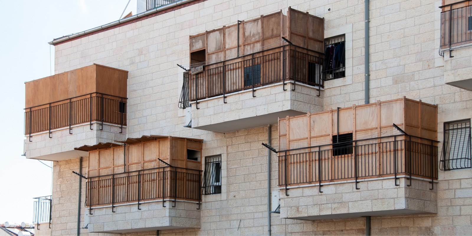 A residential building in Israel with sukkot on every balcony (Shutterstock.com)
