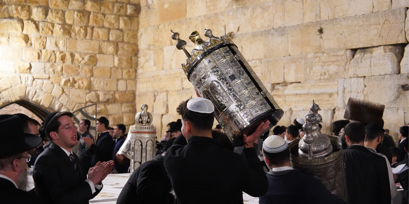 Rejoicing with the Torah at the Western Wall in Jerusalem (Shutterstock.com)