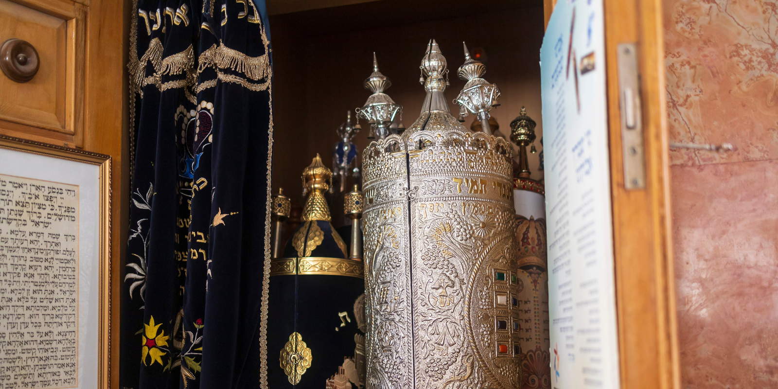 Torah scrolls in the ark of a synagogue in Haifa, Israel (Elena Rostunova, Shutterstock.com)