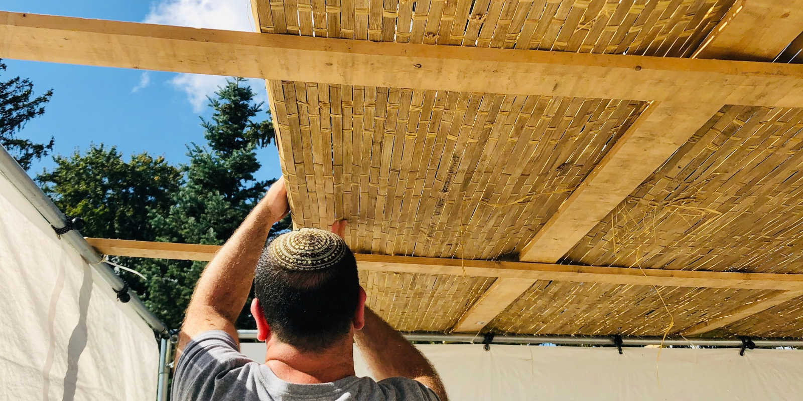Building a sukkah for the holiday of Sukkot (Shlomit Koslowe, Shutterstock.com)