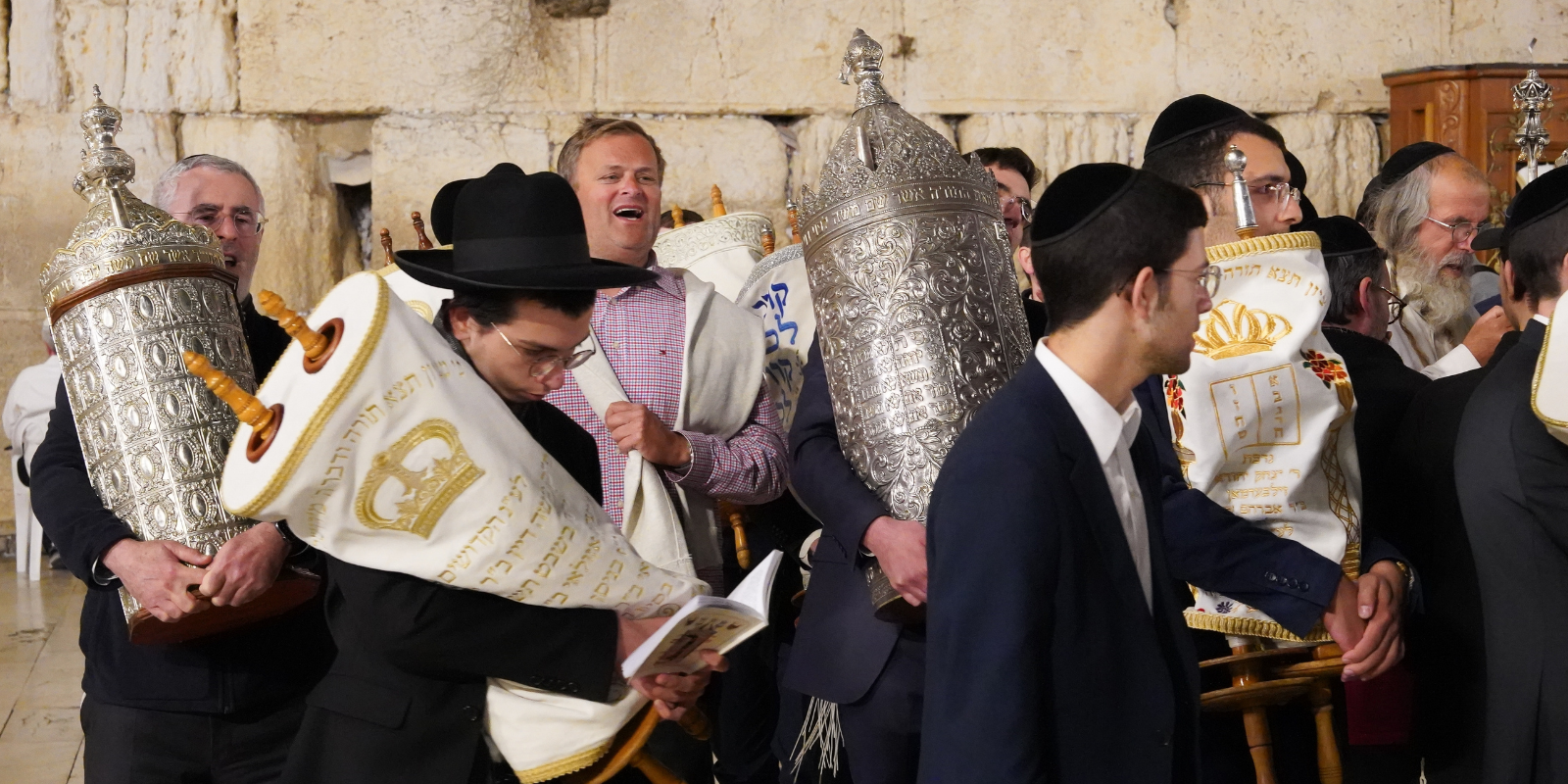 Dancing with Torah scrolls (Teo K, Shutterstock.com)